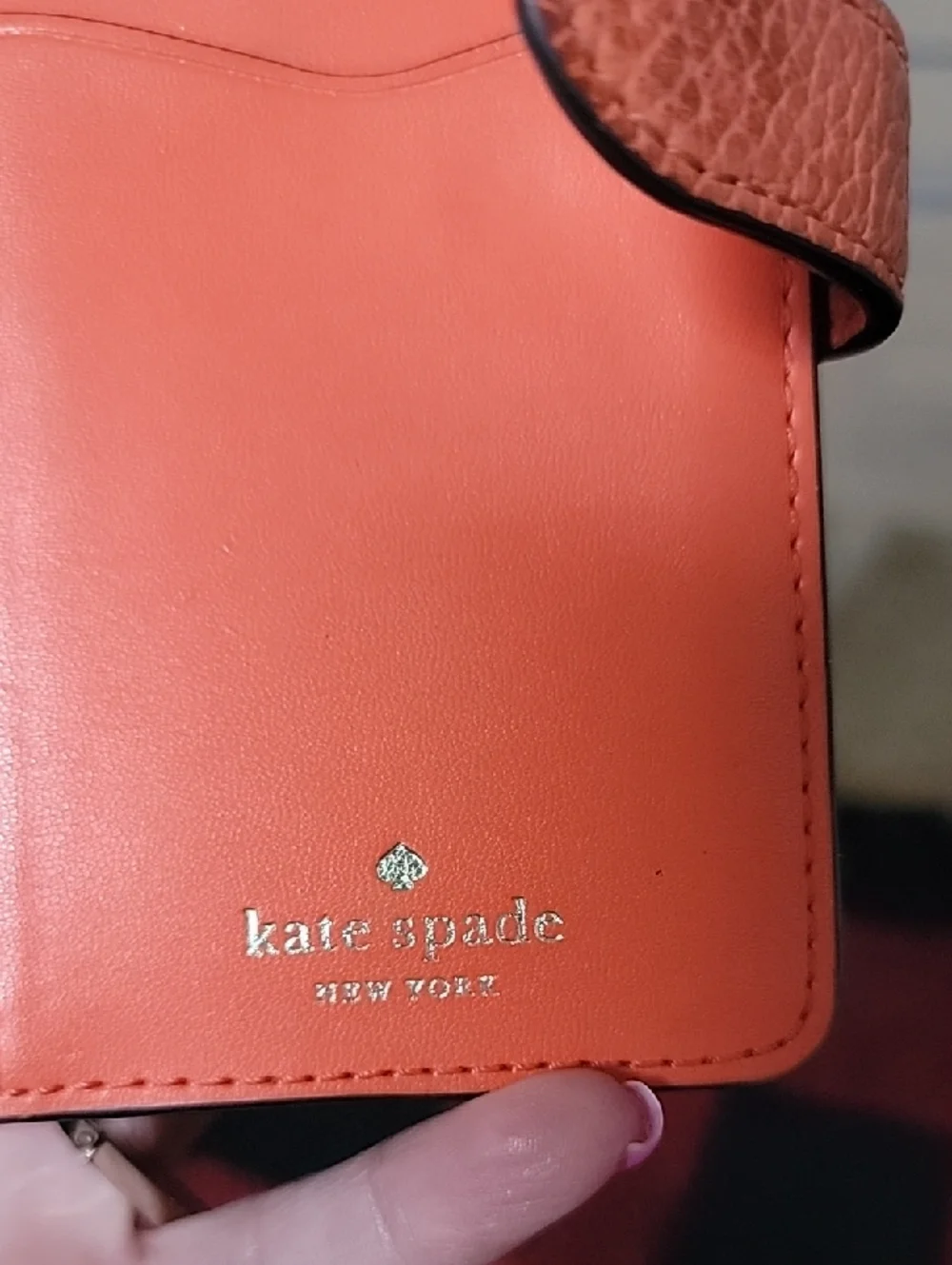 kate spade coral orange pebble leather zip-around wallet